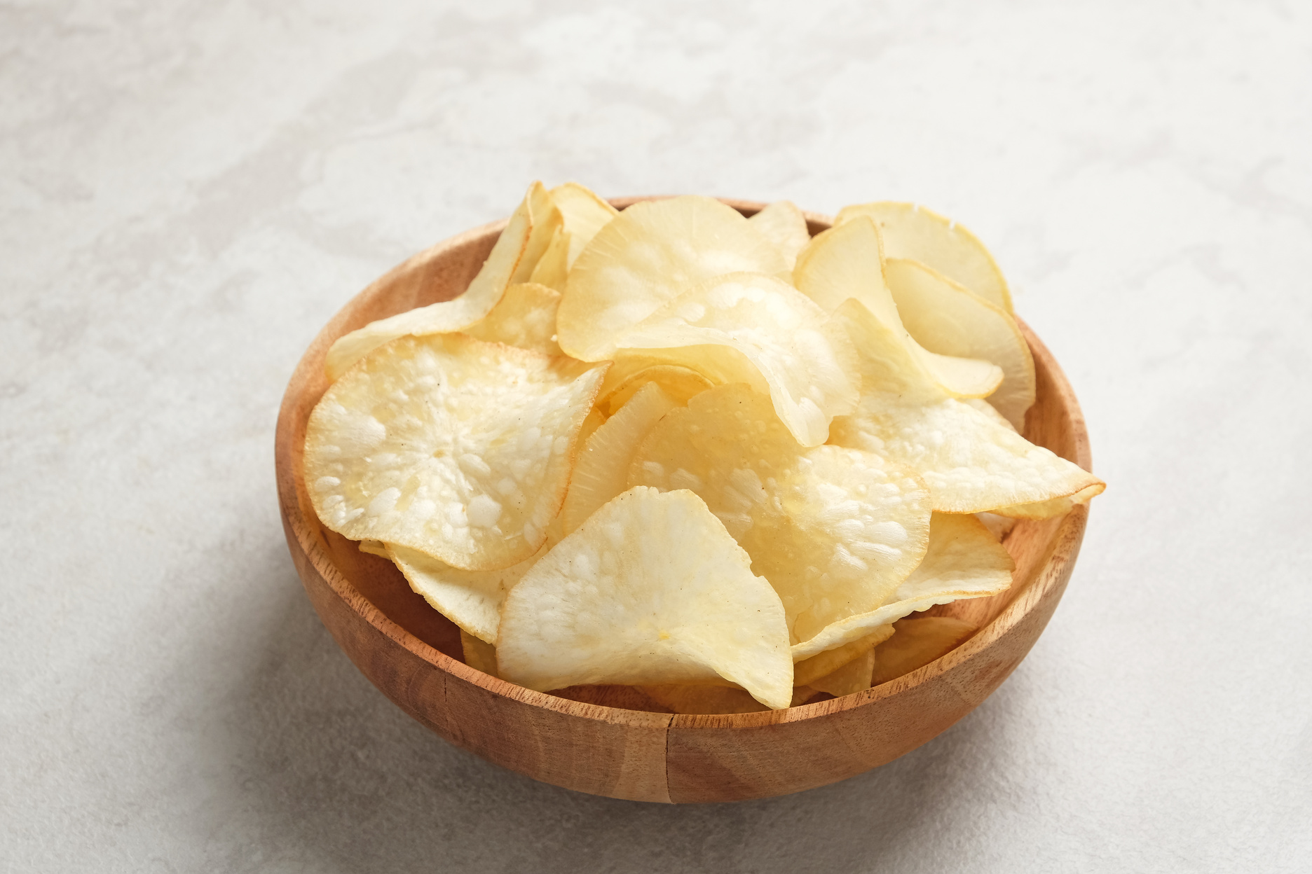 Keripik Singkong or Cassava Chips, Indonesian traditional snack. Served in bowl